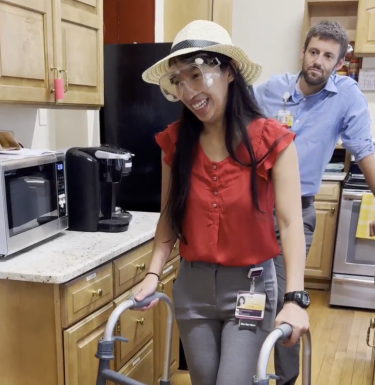 Woman with a walker navigating a kitchen